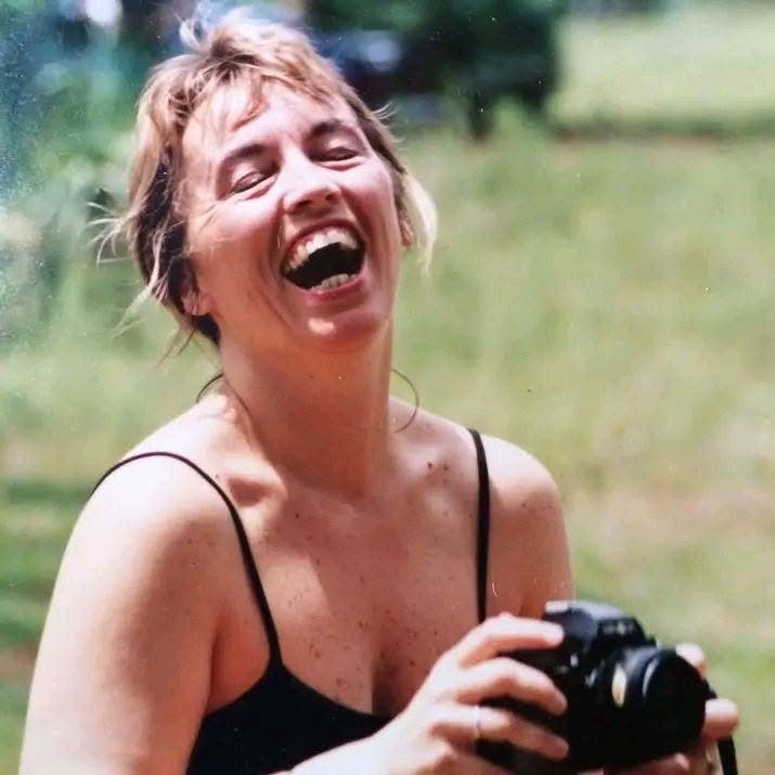 A young Lynda laughing with her camera